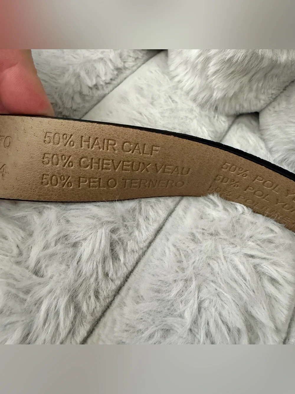 Urban Outfitters leather cow print calf hair belt.